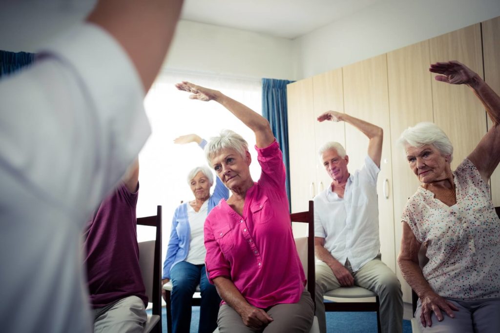 Active seniors exercising in a group together in a 55+ active adult community in Raleigh.