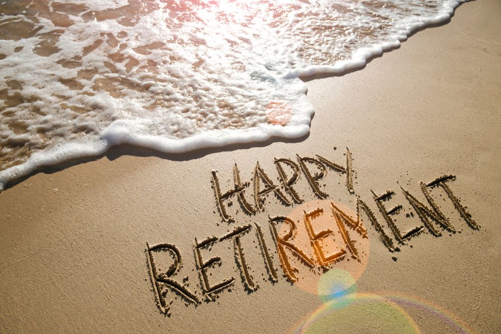 happy retirement written in sand